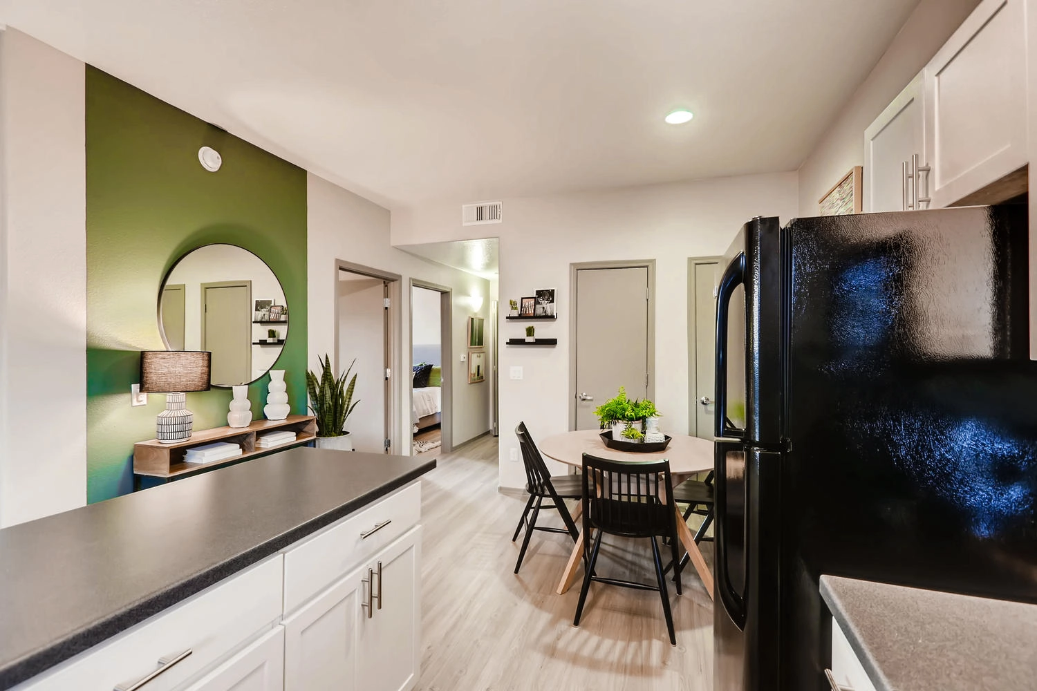 Kitchen with black counters and black appliances