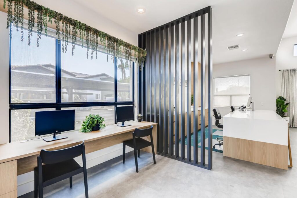 Leasing office reception desk and private computer stations