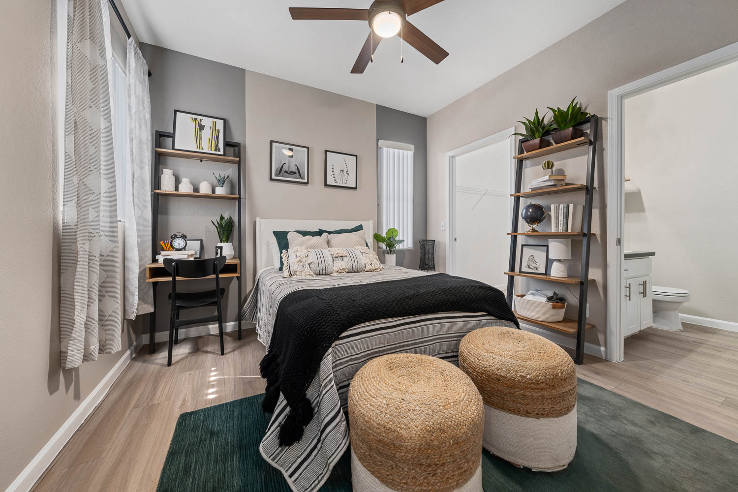 Bedroom with ceiling fan and private bath