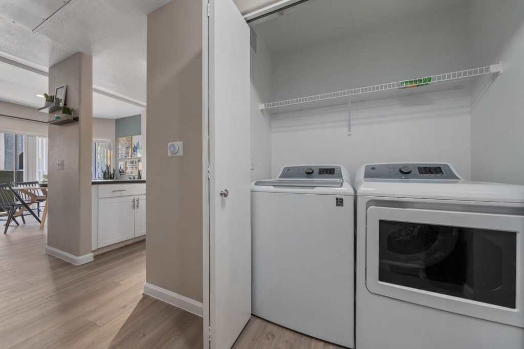 Laundry closet with side by side washer and dryer